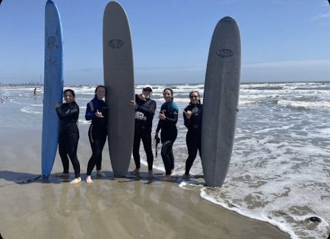 Skylar Burns, RaeAnn Duinink and Isabelle Hudnut surfing in Galveston Texas. 

