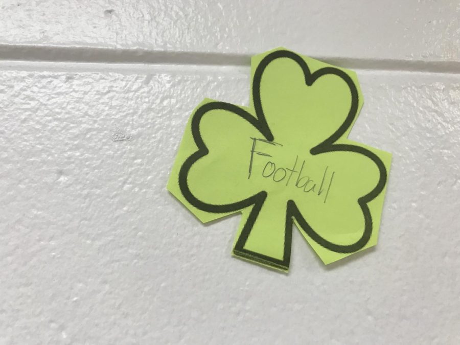 A football players shamrock. It is found in the hallway of the boys locker rooms. 
