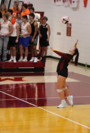 Senior Joslin Briles serves in a PCM home volleyball game. 
