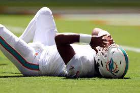 Miami Dolphins quarterback Tua Tagovailoa lays on the ground after a sack in a 21-19 loss to the Buffalo Bills on Sept. 25. Tagovailoa is now out with a concussion. Photo by Megan Briggs/Getty Images. 