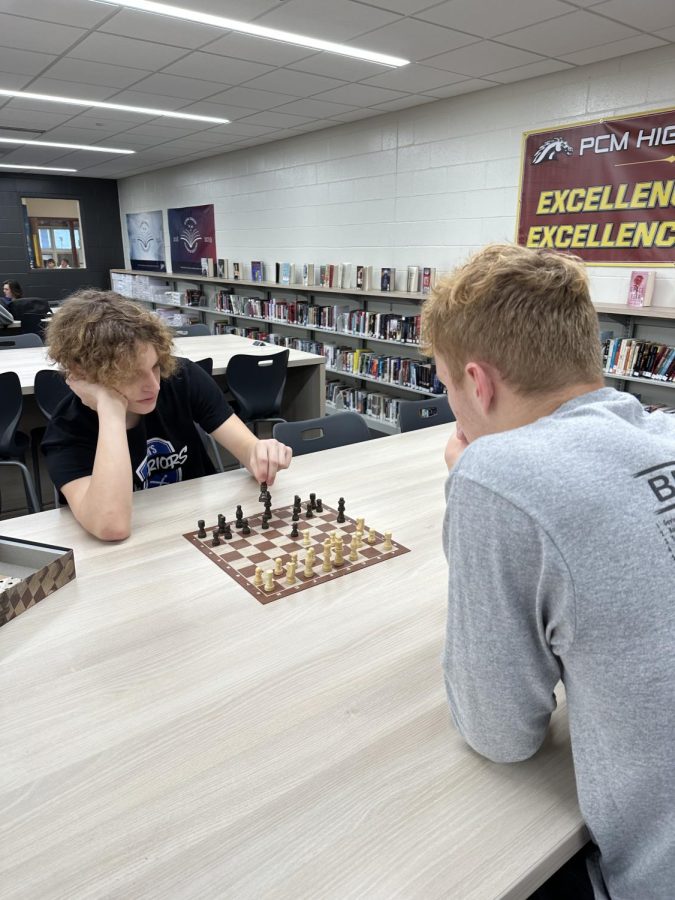 Gage Messerli (left) has played Chess for a long time, but newcomer August Stock (right) is trying his best to keep up with him. Stock became victorious despite his lack of experience. 