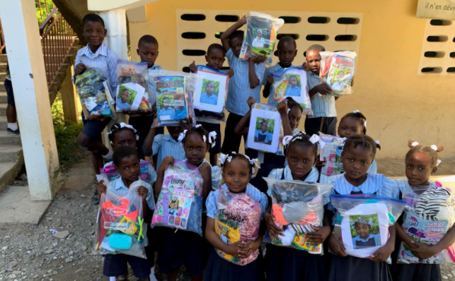 Haitian kids receiving gift bags in past years. Photo creds to Janna Bouwkamp.