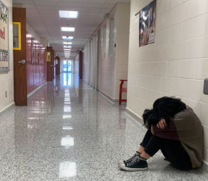 Senior Ashlyn Alleger acting depressed in the PCM High School hallways. 