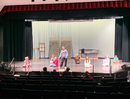 PCM Middle Schoolers practicing for the performance of “The Rockin’ Tale of Snow White” in the middle school auditorium. 