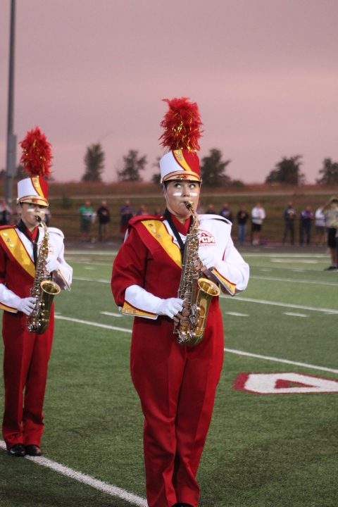 Junior Keely Spencer showing off the new band uniforms during the halftime show