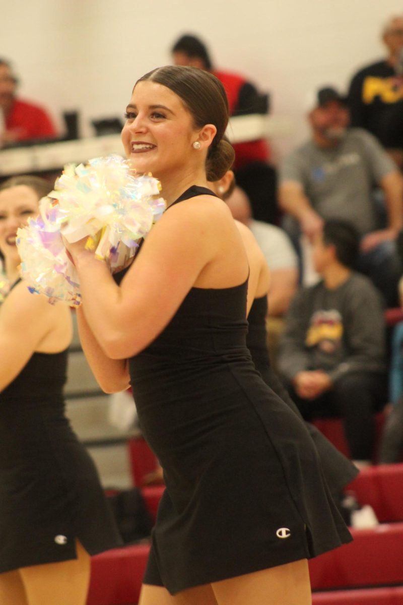 Junior Carly Steenhoek dancing at the half time of the girls basketball game.