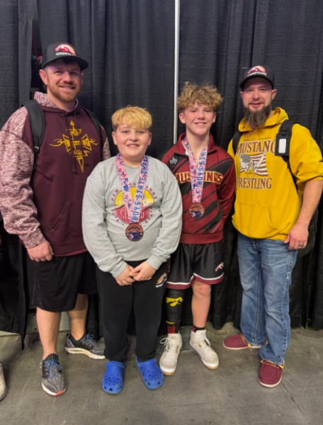 Coaches Brandon Morris and Matt Sloan with place winners Brody Witte and Nixon Kain. 